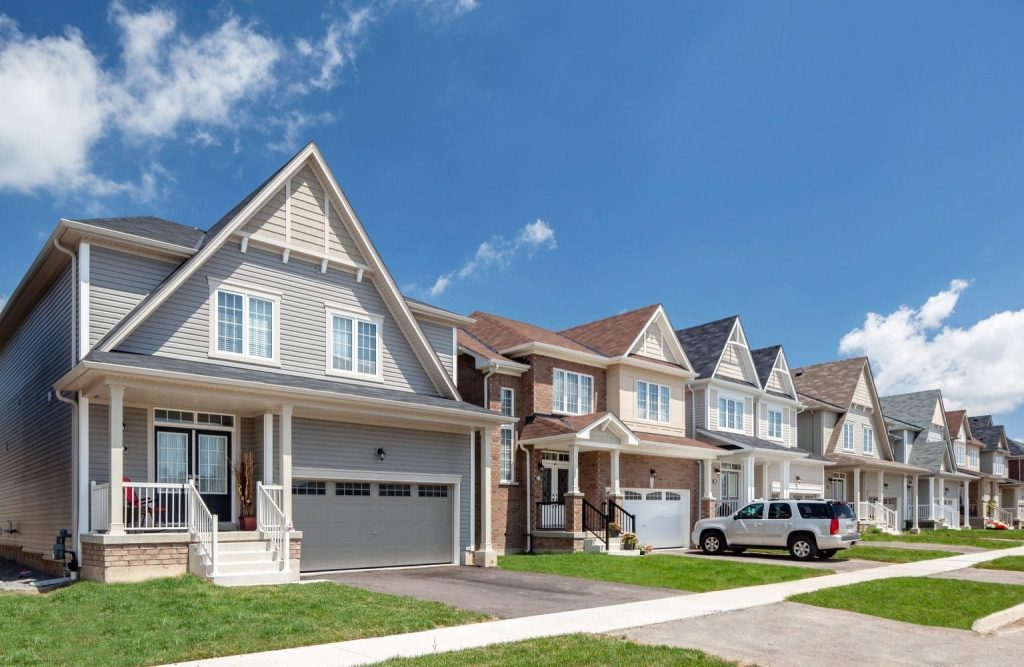 Tree-lined residential street of new homes